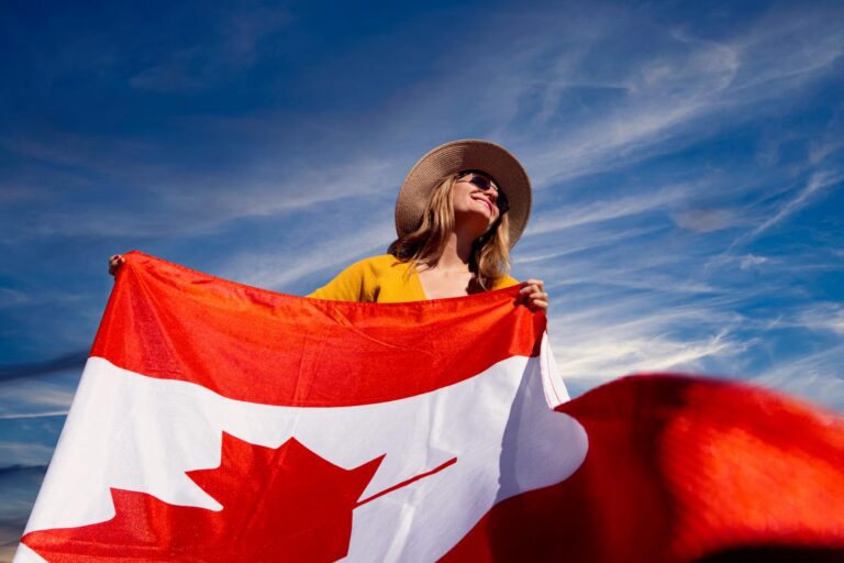 A Photograph of a Woman Holding a Canadian Flag