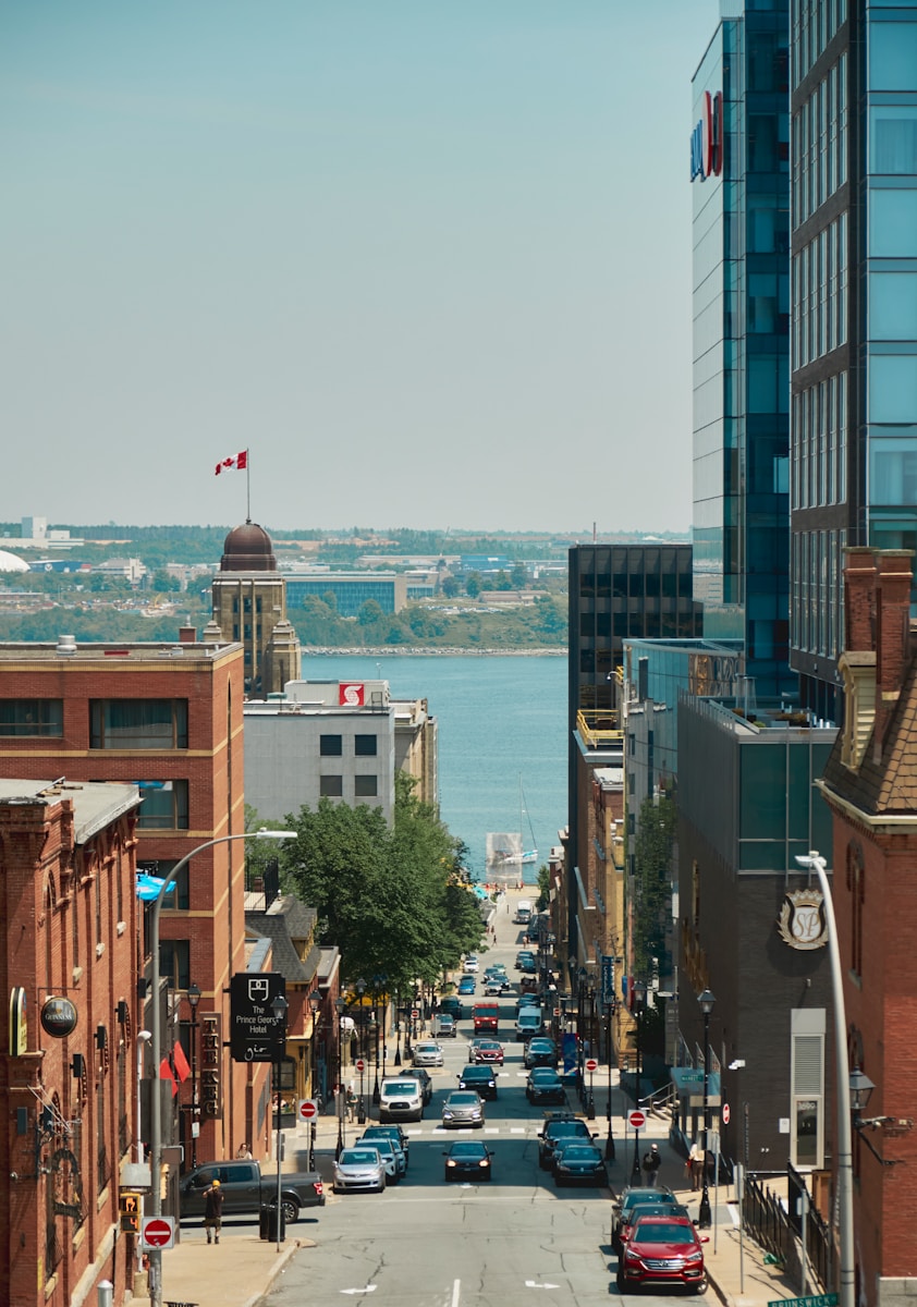 a city street with cars parked on both sides of it